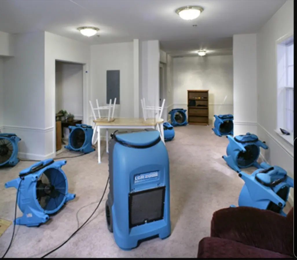 Air movers and dehumidifier setup for Water Damage Restoration in Porters Neck